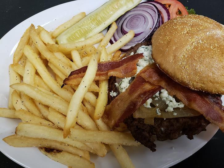 BBQ Bacon Burger · 8 oz. brisket/chuck burger tossed in famous Anchor Bar spicy BBQ sauce, bacon, cheddar cheese and caramelized onion on our fresh brioche roll. Served with choice of side.