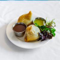 Vegetable Samosa · Deep fried patties stuffed with spices, potatoes and peas. Served with tamarind sauce.