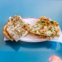 Garlic Cilantro Naan · Traditionally baked bread with garlic and cilantro.