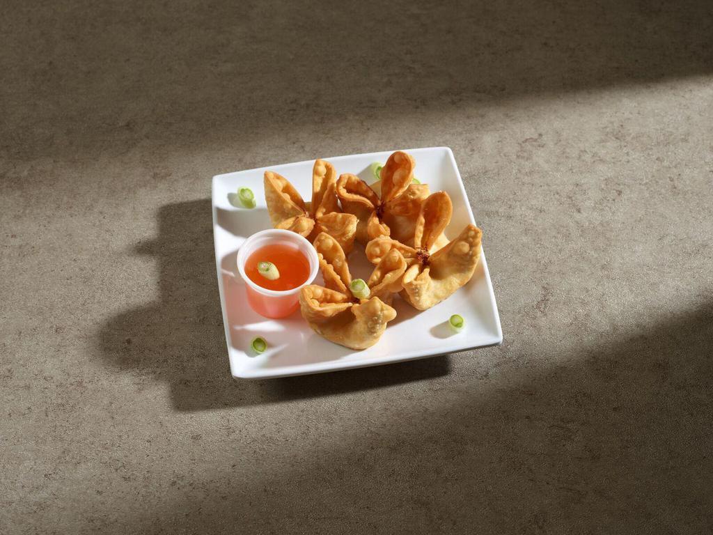 Crab Rangoon · Crab meat and cream cheese in a golden wonton skin.