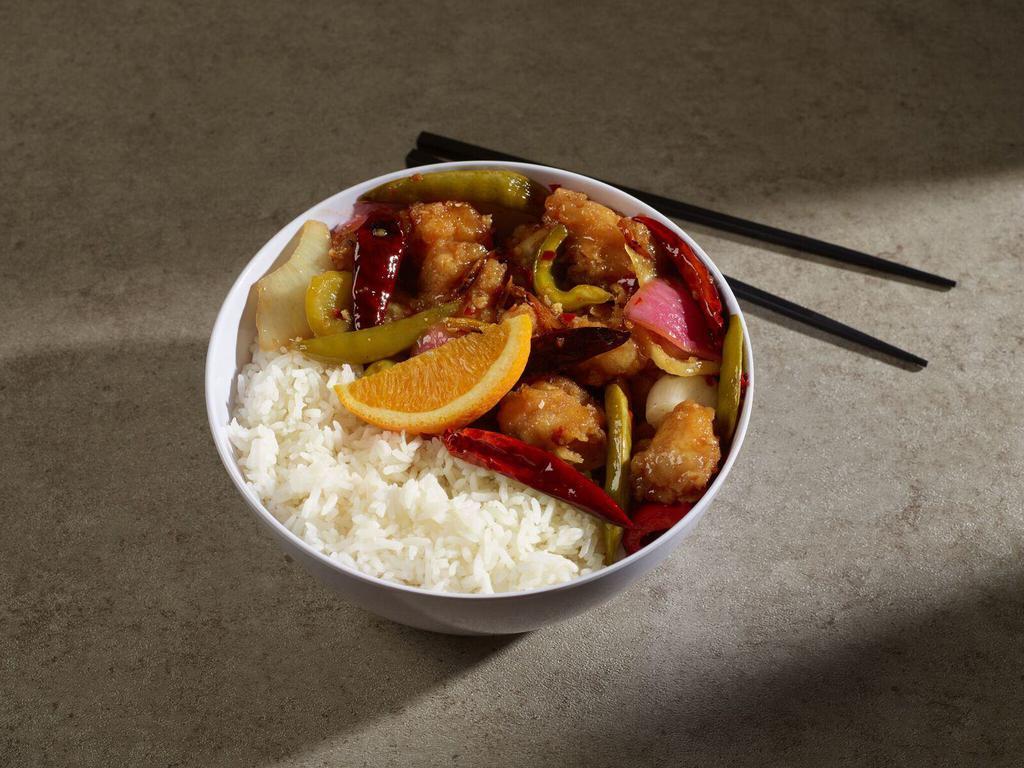 Orange Chicken · Fried golden brown and tossed with citrus orange peels in sweet and spicy sauce. Spicy. 