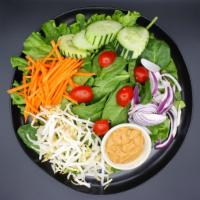 Thai Salad · Lettuce, carrot, bean sprouts, cucumber, tomatoes and tofu with side of Thai peanut dressing.