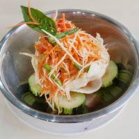 Thai Papaya Salad · Tossed striped papaya and string beans, carrot, tomatoes, and roasted peanuts in a spicy lim...