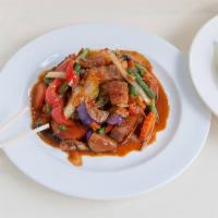 Pad Ped Crispy Pork Belly · Sauteed eggplant, bell pepper, basil and wild ginger in spicy red curry paste.