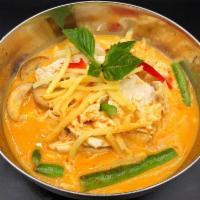 Panang Curry · Slightly sweet and spicy with bell peppers, string beans, carrots and kaffir lime leaves.