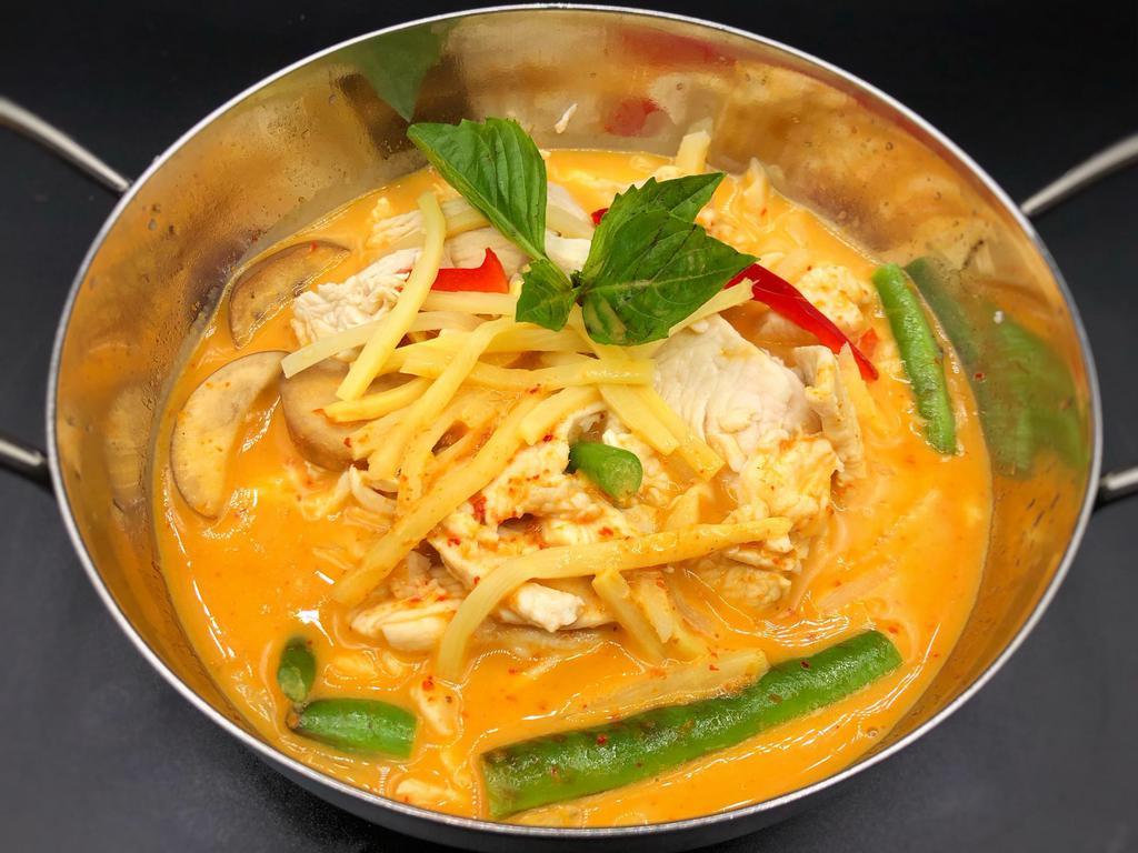 Panang Curry · Slightly sweet and spicy with bell peppers, string beans, carrots and kaffir lime leaves.