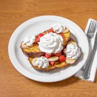 French Toast Crunch · Sweet granola-crunch coating, strawberries, bananas and whip.