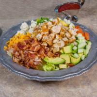 Cobb Salad · On lettuce topped with fresh chicken strips, hard boiled egg, tomatoes, cucumber, cheddar ch...