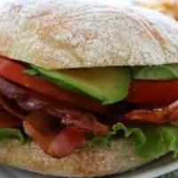 Al’s Famous Club Sandwich · Ovengold turkey breast, avocado, Swiss cheese, crispy bacon, mayo, lettuce, tomato, onion an...
