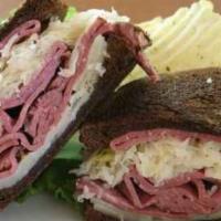 The Reuben Sandwich · An east coast classic. Hot corned beef, with melting Swiss cheese Dijon mustard, sauerkraut ...