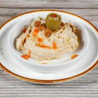 Hummus · Chickpea paste and tahini sauce topped with olive oil and paprika.