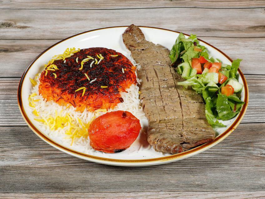 Barg · 1 skewer of marinated fillet of beef with grilled tomato served with tahdig rice.