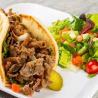 Gyro Wrap · Gyro meat in a pita with salad and tzatziki sauce.