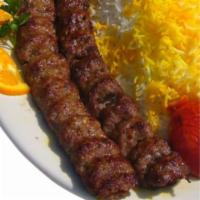 2 Skewers of Ground Beef Kabob · Koobideh. 2 skewer of ground beef mixed with pured onion and spices, served with grilled tom...