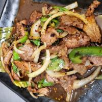 4. Spicy Mint Chicken · Stir-fried chicken, onions, bell peppers and Thai basil leaves. Served with white rice.