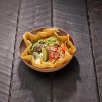 Taco Salad · Flour tortilla bowl filled with refried beans and lettuce. Topped with pico de gallo, sour c...