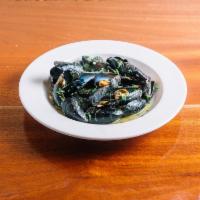 Mussels Bianco · Served with white wine butter garlic sauce.