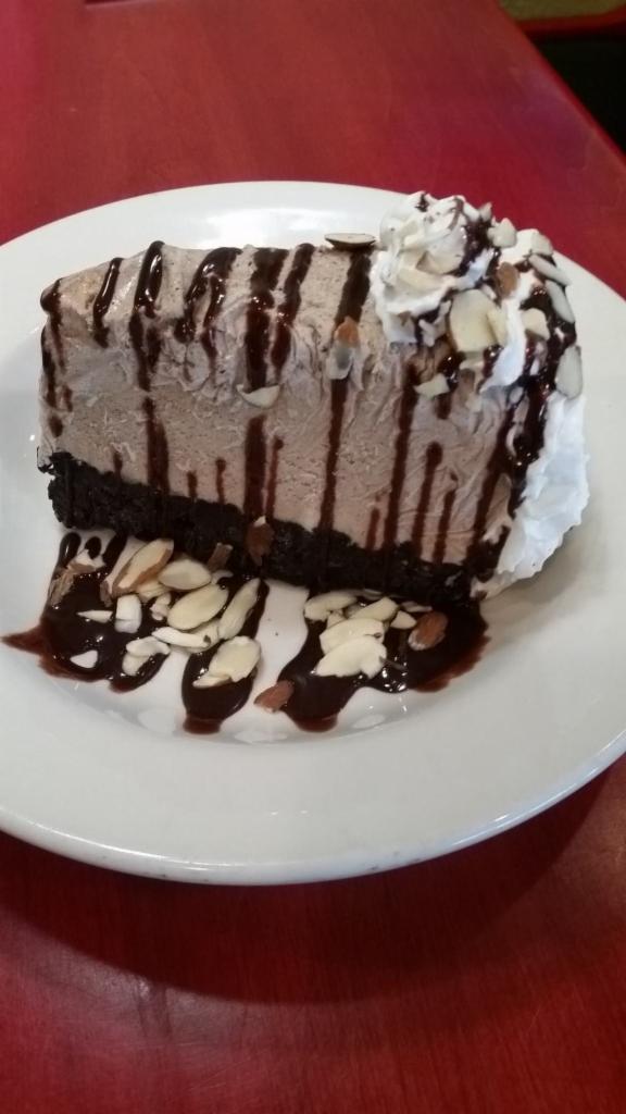 Mudd Pie · Made with cinnamon ice cream on chocolate cookie crust, whipped topping, chocolate sauce, and sliced almonds.