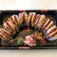 8 Pieces Kiss of Fire Roll · Slice salmon on top of California roll with spicy mayo then baked with eel sauce.