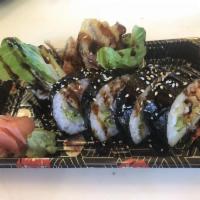 6 Pieces Spider Roll · Deep fried soft shell crab and spicy crab mix, cucumber and avocado inside and topped with e...
