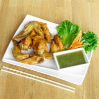 Thai Chicken Wing ·  All natural chicken wings marinated in homemade Thai marinade sauce,  fried to a golden bro...