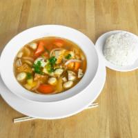 Large Thom Yum Soup · Thailand’s savory hot and sour soup with mushrooms, tomatoes, onions, cilantro, lime leaves,...