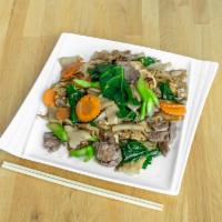Pad See Iew · Chinese broccoli and carrots stir-fried in homemade light brown sauce with wide rice noodle ...