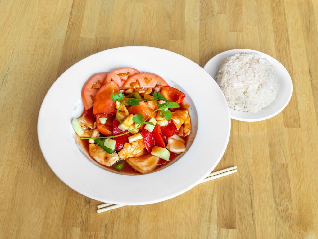 Pad Sweet and Sour · Onions, tomatoes, bell peppers, and pineapples stir-fried in a sweet and sour tangy sauce. Gluten-free. 