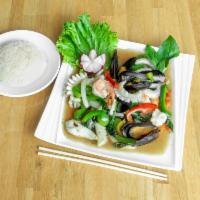 Seafood Basil · Stir-fried shrimp, squid and mussels with bell peppers and onions in homemade basil sauce. 