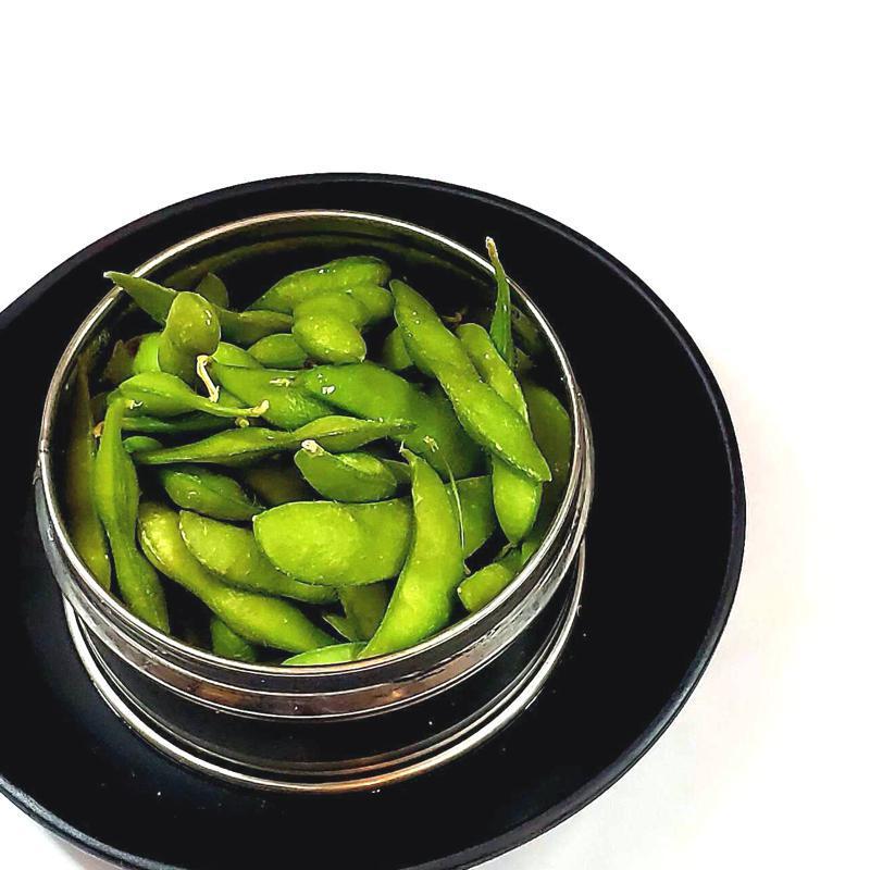 Edamame · Steamed green fruit soybeans in the pod seasoned with sea salt.
