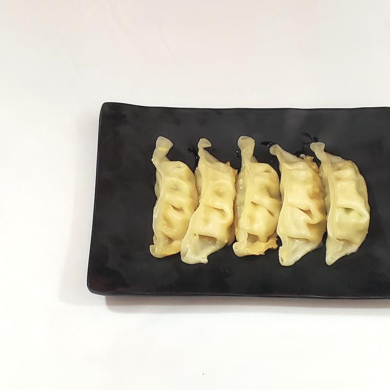 Gyoza · Steamed or pan-fried Japanese pork dumplings with house-made sweet and sour soy sauce.
