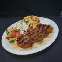 Kofte Kebab · Grilled seasoned ground beef with spices and herbs. Served with rice, Greek salad, and the H...