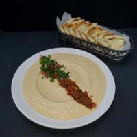 Hummus · Mashed chickpeas, mixed with fresh lemon juice, minced garlic, olive oil and tahini.