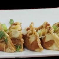Pot Sticker · Dumpling stuffed with ground chicken, vegetable, topped with teriyaki, spicy mayo, sriracha ...