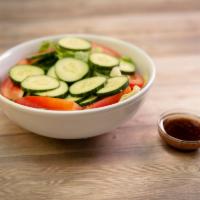 House Salad · Romaine lettuce, tomatoes, cucumbers and homemade balsamic vinaigrette.