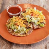 Tostadas · 2 pieces with your choice of meat, beans, cheese, guacamole, lettuce, and tomato. Comes with...