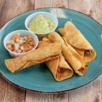 Taquitos · 4 rolled corn tortillas with chicken and cheese and fried. Served with avocado crema and pic...
