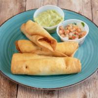 Flautas · 3 flour tortillas filled with chicken and cheese and fried. Served with avocado crema and pi...