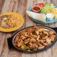 Fajitas Dinner · Choice of meat, grilled veggies, meat with beans and rice. On the side comes 4 flour tortill...