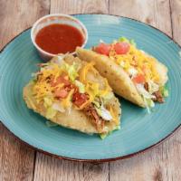 Puffy Tacos Dinner · Puffed and fried corn masa tortilla. Choice of meat, lettuce, tomato and cheese. Comes with ...