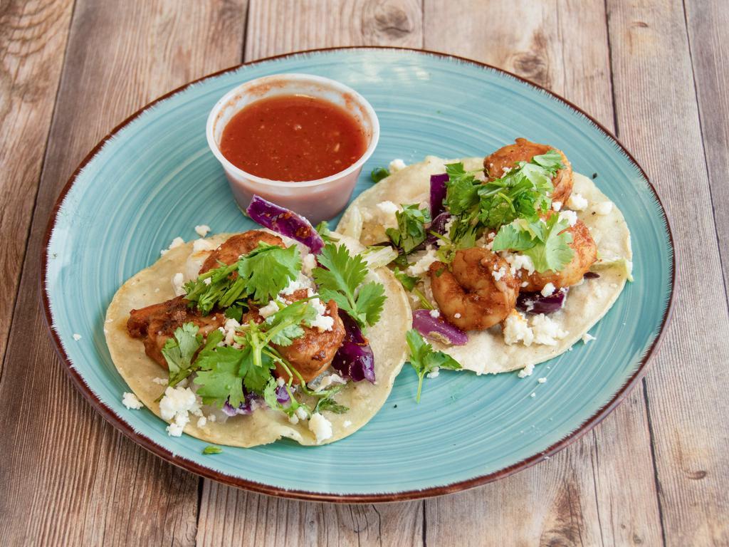 Shrimp Taco Dinner · Grilled shrimp on 3 corn tortillas. Topped with homemade coleslaw, queso fresco, cilantro and lime. Comes with a medium/hot salsa unless a mild salsa is requested. Side of beans and rice.