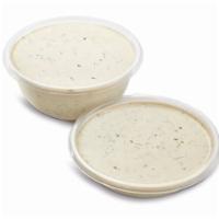 Tahini (Sesame Sauce) · A smooth and creamy nutty sauce made from sesame seeds. Made in-house every day.