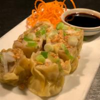 Kanom Jeeb · Steamed dumplings with crabmeat, shrimp, chicken, and water chestnuts