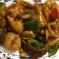 H7. Four Treasures · Scallops, shrimp, beef, chicken sauteed with vegetables in a spicy garlic sauce. Hot and spi...