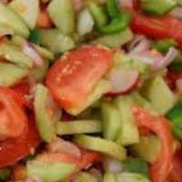 Garden Salad · Lettuce, tomatoes, onions, cucumbers and olives. Served with your choice of dressing on the ...