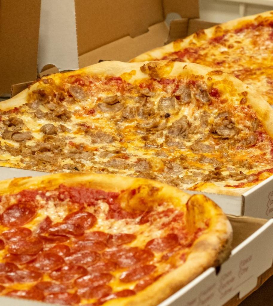 Family Feast # 6 · Two medium one topping pizzas, 6 garlic knots, large beverage.

Choose different toppings for different pizzas just specify in instructions.