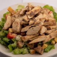 Grilled Chicken Caesar Salad · Marinated charbroiled chicken on top of our Caesar salad. Ceasar dressing on the side