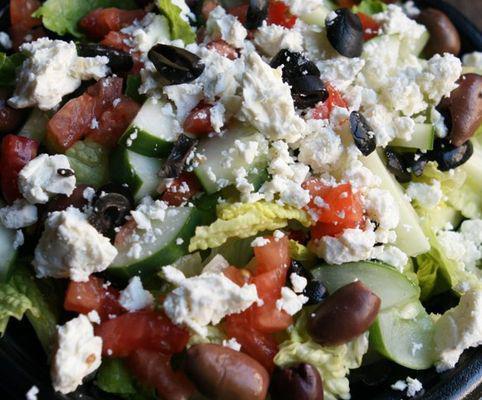 Greek Salad · Crisp lettuce, tomatoes, onions, cucumbers, olives and feta cheese. Served with your choice of dressing on the side.