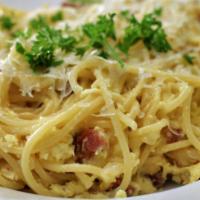 Spaghetti Carbonara · Made with eggs, bacon, cream, butter grated cheese