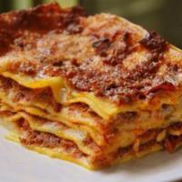 Baked Lasagna · Lasagna pasta layered with seasoned chop meat, ricotta, mozzarella and grated Parmesan cheese.